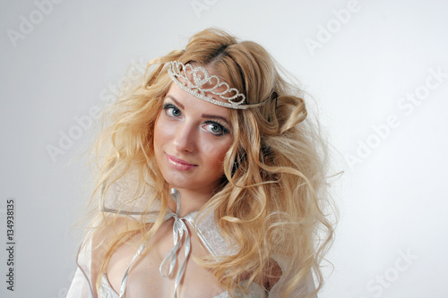 Girl with lush hair dressed as the Snow Queen