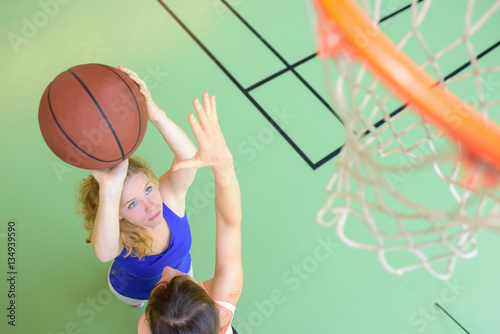 woman playing basketball photo