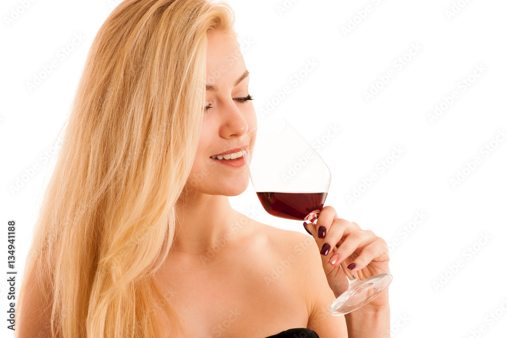 Cute blonde woman drinks a glass of red wine isolated over white Cute blonde woman drinks a glass of red wine isolated over white