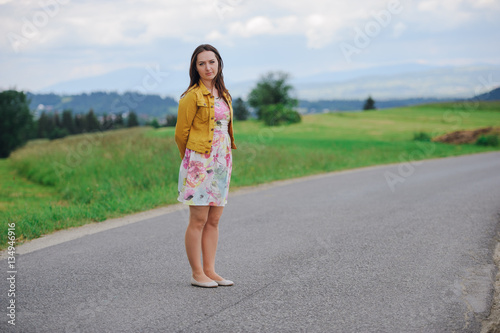 girl standing on asphalt