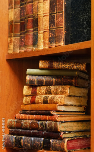 Retro books on wooden shelf