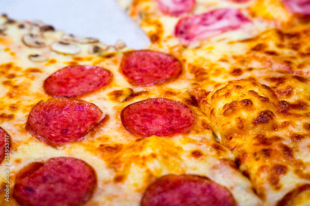 Four taste pizza with pepperoni cheese mushrooms and becon useful for background Four taste pizza with pepperoni cheese mushrooms and becon useful for background
