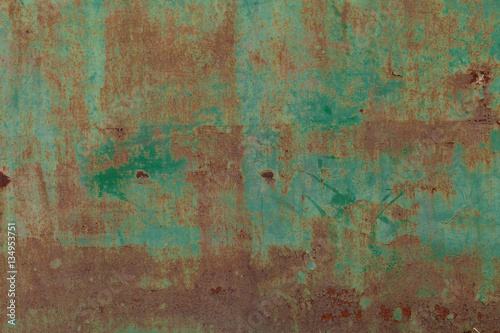 Rusty surface of green metal plate. Rusty texture backdrop. Rust on old metal. Rust on old green fence. Grunge ruststained metal fence. Mildew on green iron-plate fencing. Seedy bingery paling © peter