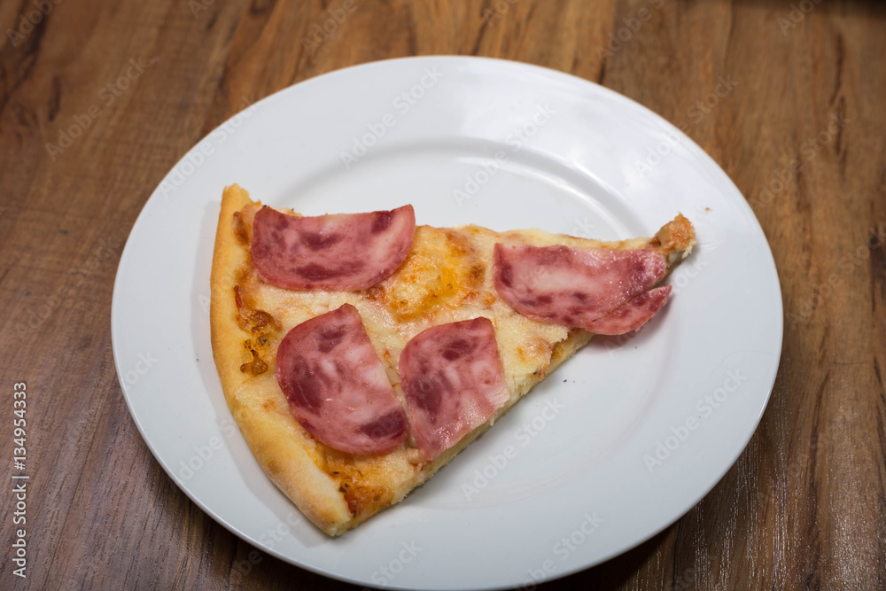Four taste pizza with pepperoni cheese mushrooms and becon useful for background Four taste pizza with pepperoni cheese mushrooms and becon useful for background