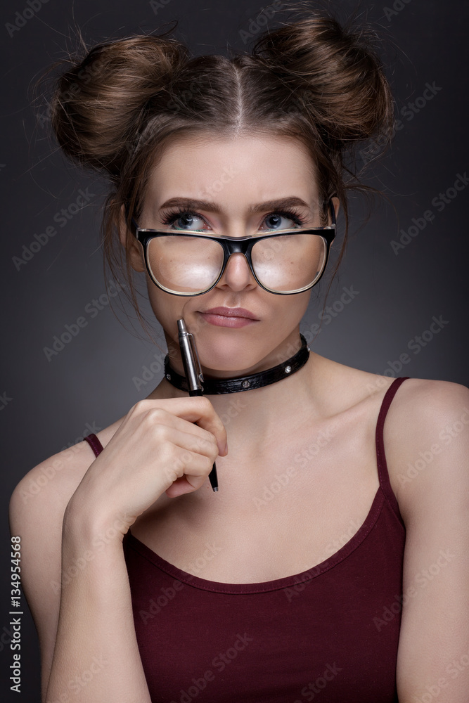 Portrait of a beautiful girl in the image of the student. Portrait of a beautiful girl in the image of the student.