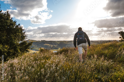 A Hiker approaching a majestic view in New Zealand