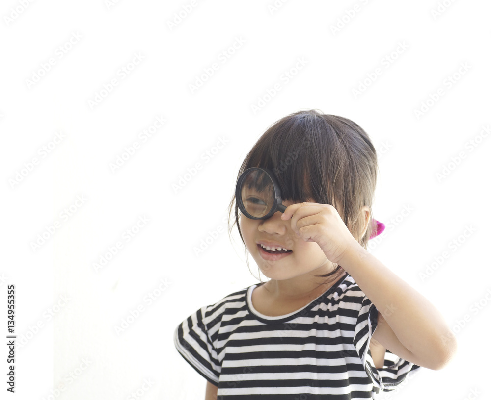 Asian young girl use magnifier isolated on white background Asian young girl use magnifier isolated on white background