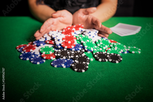 Poker player going all in photo