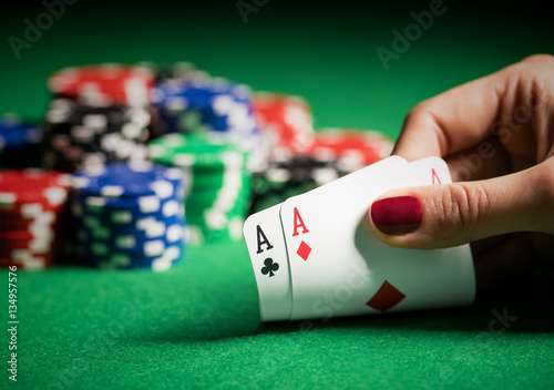 Person showing her deck at the poker game photo