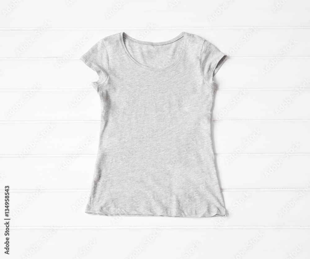Grey women's t-shirt on the floor Grey women's t-shirt on the floor