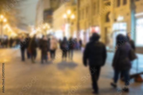 Blurred image of People walking on Arbat street at night