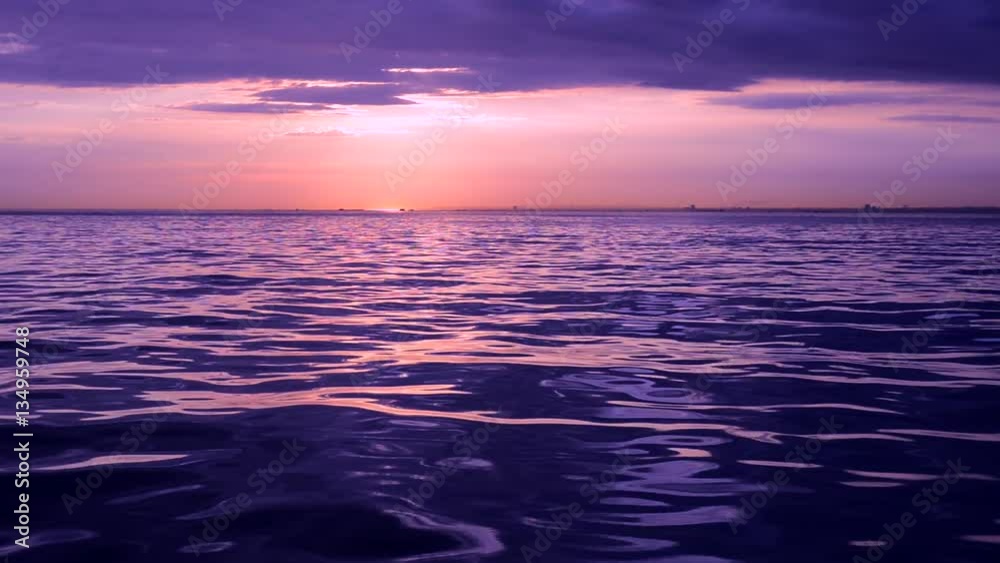 Sailing the sea into the dreamy purple sunset Sailing the sea into the dreamy purple sunset