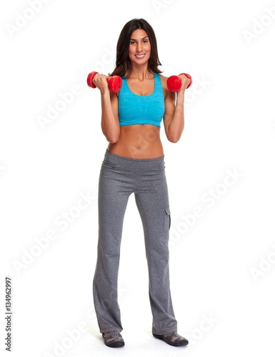Athletic girl with dumbbells.