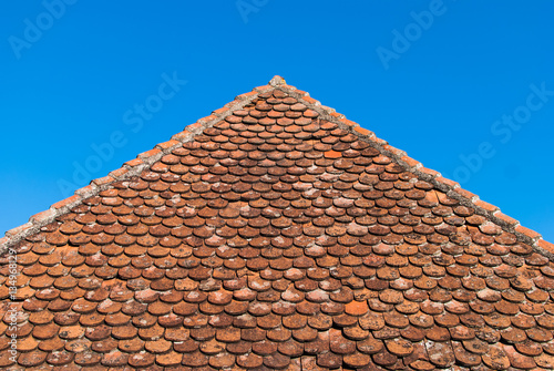 Old ceramic tile roof pointing upward