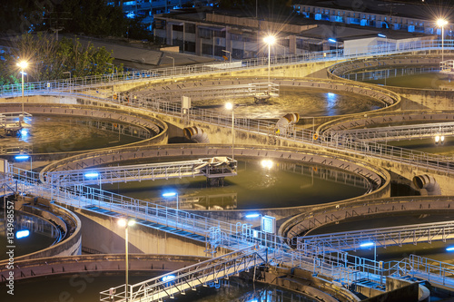 Modern urban wastewater treatment plant.Water purification is the process of removing undesirable chemicals  suspended solids and gases from contaminated water. Water cleaning facility outdoors.