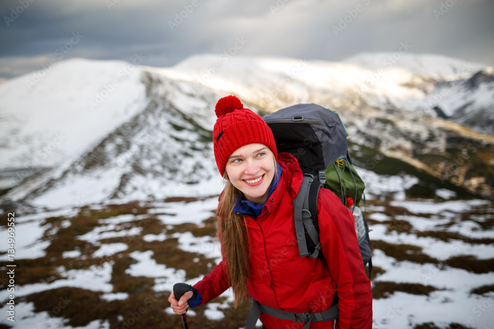 Young woman in winter mountains