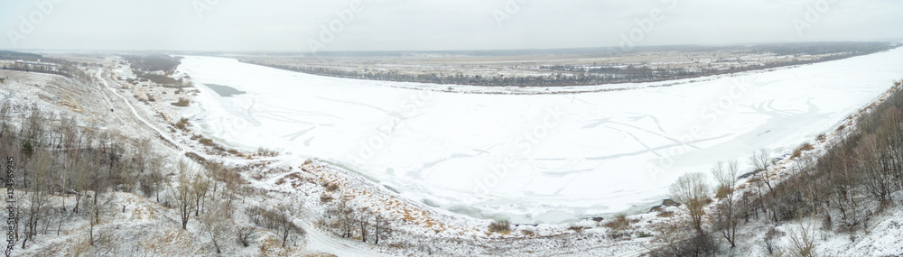 Aerial view of snow covered countryside