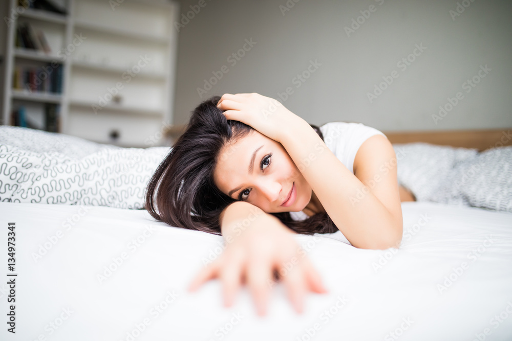 Fototapeta premium Portrait of beauty woman lying in bed at home