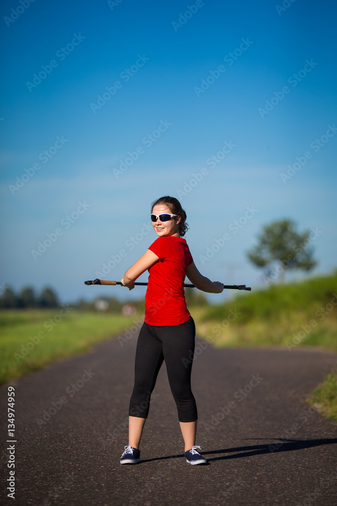 Nordic walking - young woman training 