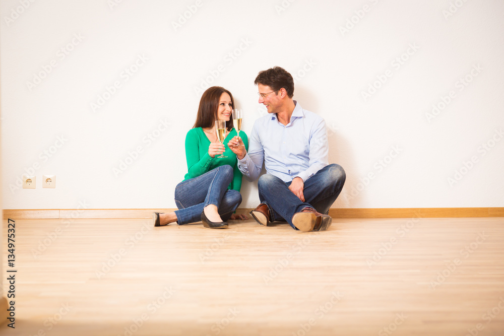 Adult Couple Celebrating Their New Apartment Adult Couple Celebrating Their New Apartment