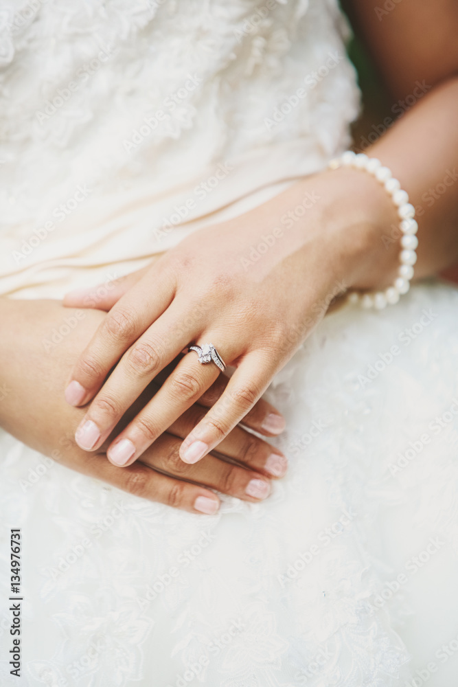 Young brides hands with wedding ring Young brides hands with wedding ring