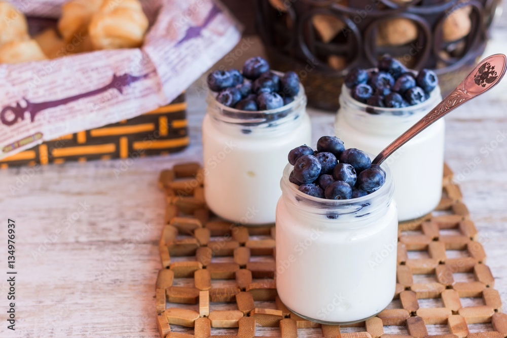 Yogurt with berries in a glass jar Yogurt with berries in a glass jar