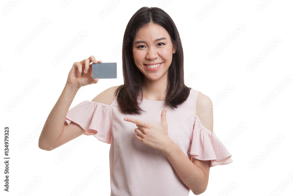 Young Asian business woman point to a blank card. Young Asian business woman point to a blank card.