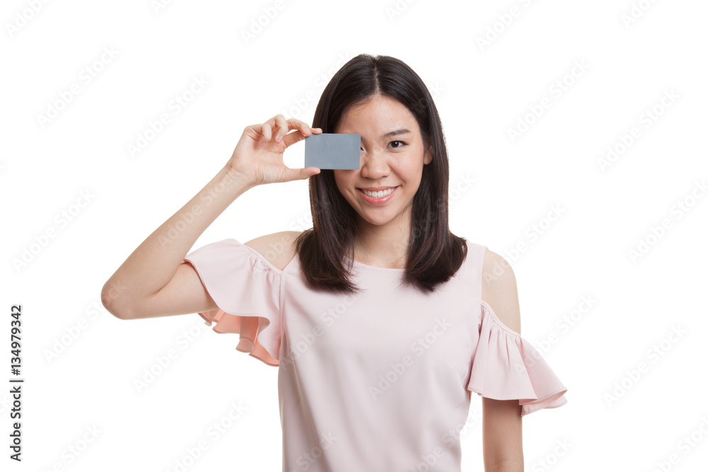 Young Asian business woman with blank card over her eye. Young Asian business woman with blank card over her eye.