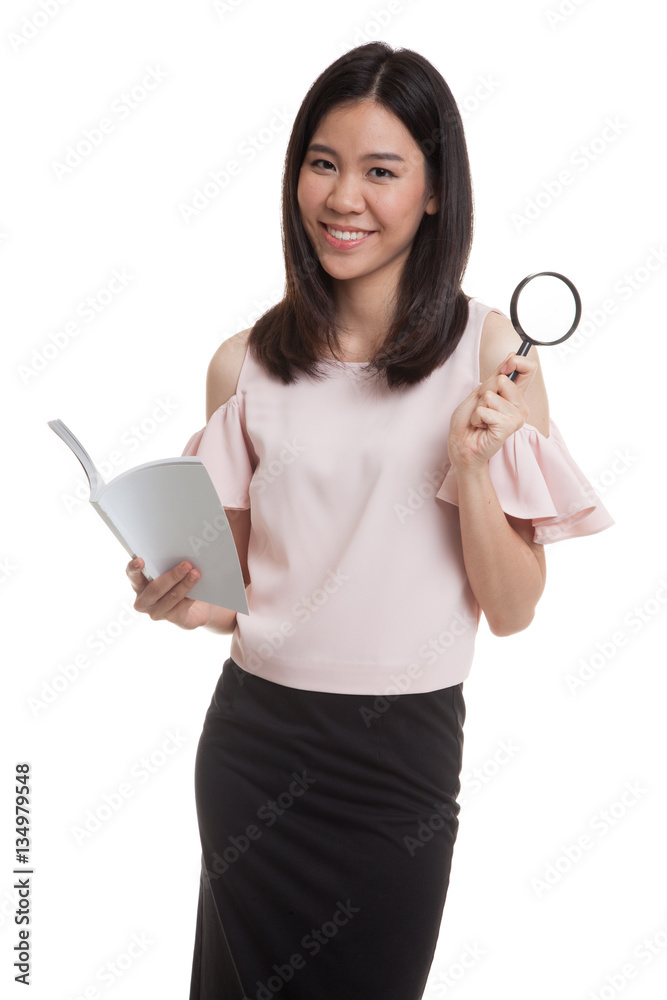 Asian business woman with a book and magnifying glass. Asian business woman with a book and magnifying glass.