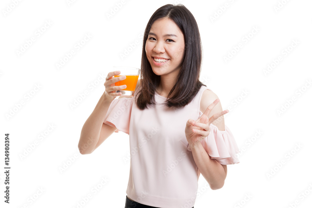 Young Asian woman show victory sign drink orange juice. Young Asian woman show victory sign drink orange juice.