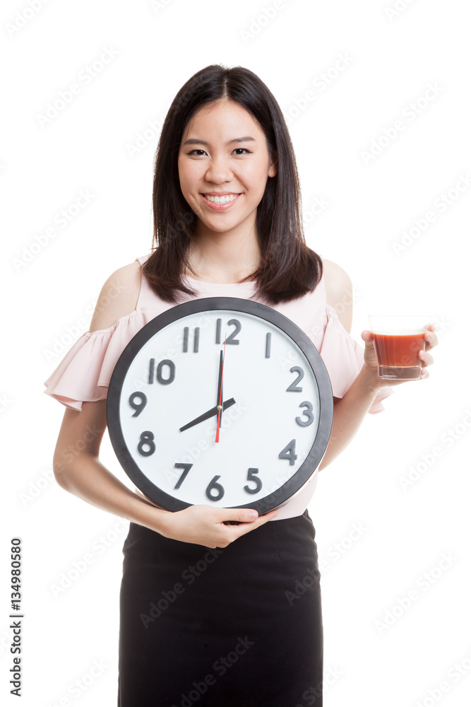 Young Asian business woman with tomato juice and clock. Young Asian business woman with tomato juice and clock.