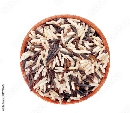 Wild, white and brown rice in a wooden bowl, isolated on white background