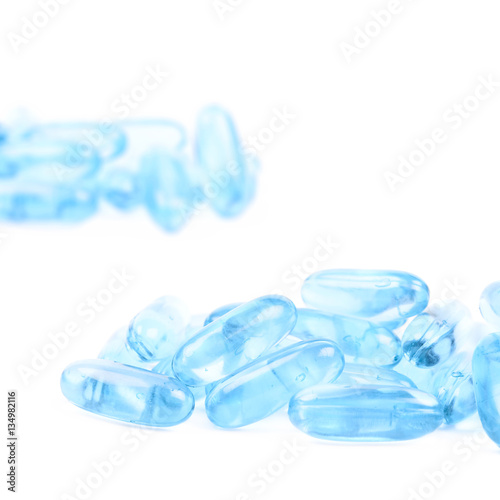 Pile of blue softgel pills isolated