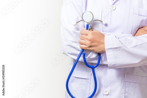 Doctor holding a stethoscope on white background. Medical and he