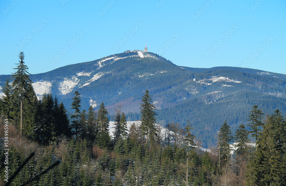 Lysa hora mountain with spruce forests and transmitter on the top in Beskydy mountains in winter