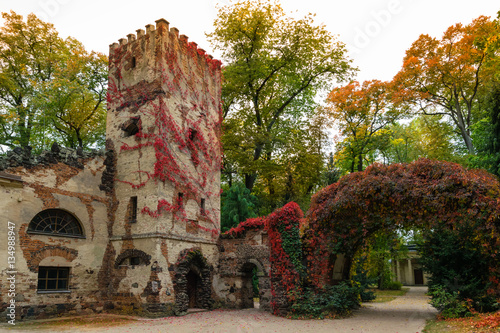 Arkadia, Poland - September 30, 2016: Burgrave's house and stone arch in the  sentimental and romantic Arkadia park,  near Nieborow, Central Poland, Mazovia. Garden in the English style