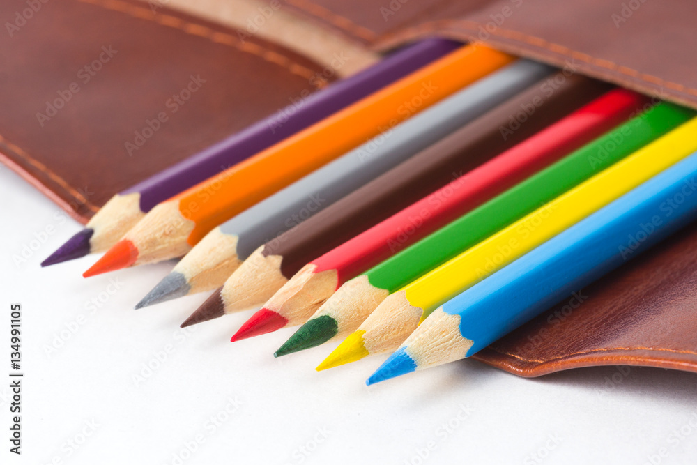 Naklejka premium colored pencils in a leather case