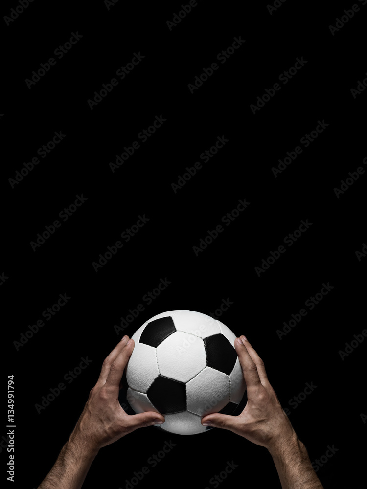 soccer ball in male hands