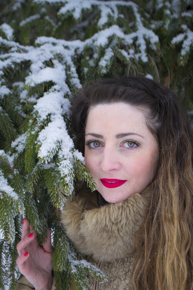 girl the fir-tree in winter Park