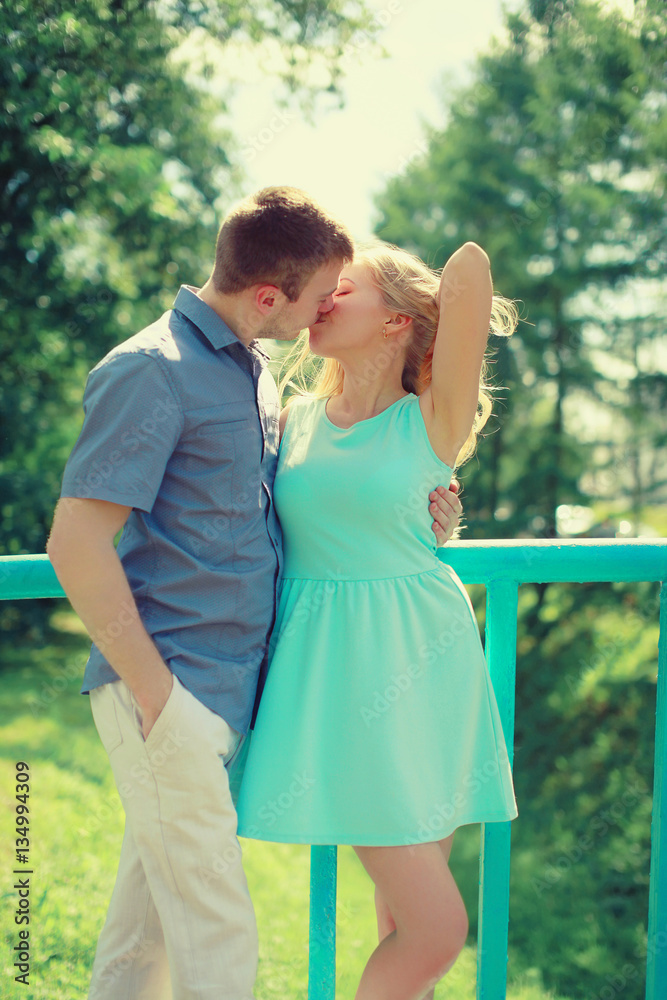 Naklejka premium Sensual kiss, couple in love enjoying each other in the city