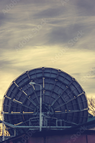 Very Large Array satellite dishes in Voronezh, Russia. Sunset sky background. 