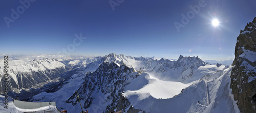 Skiers descending roped path route on arête to ski Vallee Blanche from Aiguille du Midi Chamonix-Mont-Blanc Rhone-Alpes France © gekkon4ik