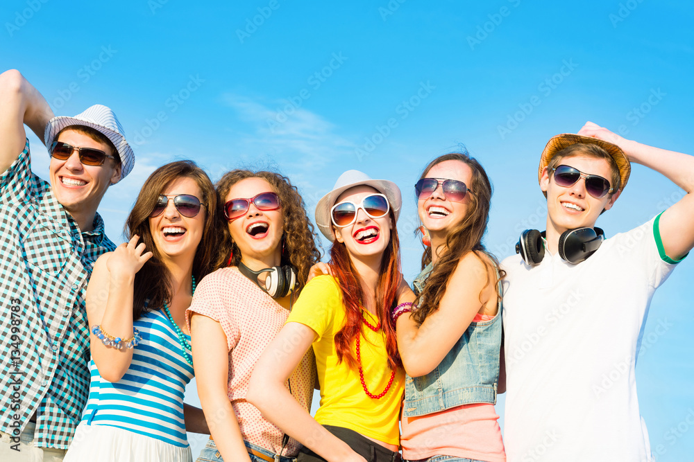 group of young people wearing sunglasses and hat group of young people wearing sunglasses and hat