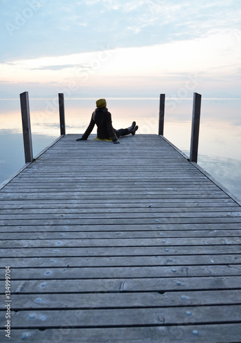 Girl on the pier. Lake of Zug, Switzerland
