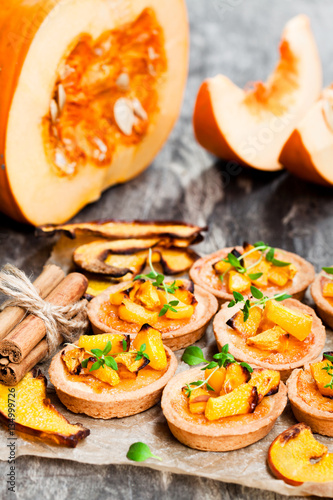 delicious  tartlets with baked honey pumpkin and cinnamon on rus