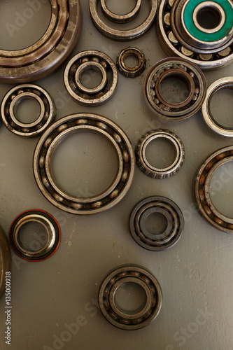 old bearings on a wooden background close up