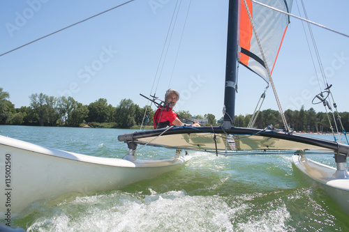 enjoying extreme sailing with racing sailboat