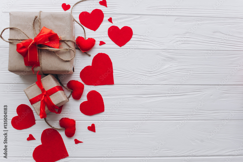 Valentine's Day. presents, heart felt and decor on wooden background - obrazy, fototapety, plakaty 