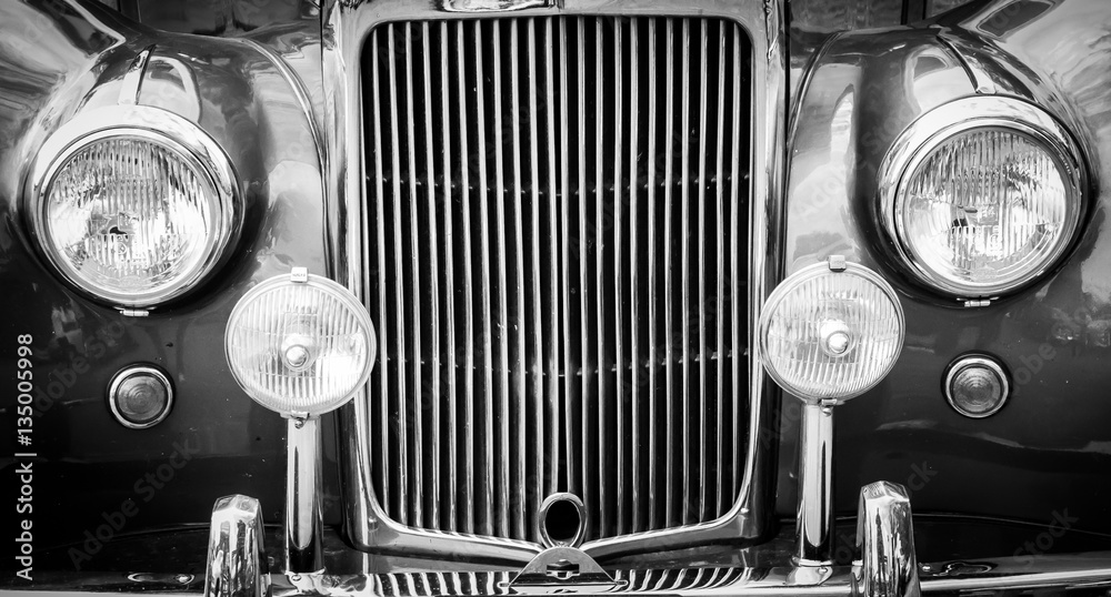 Black and white vintage car headlights and grill