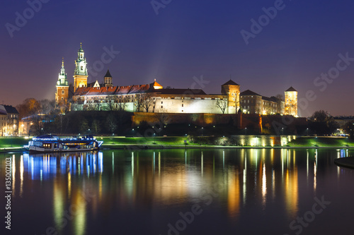 Wawel Castle in the evening in Krakow with reflection in the river  Poland. Long time exposure